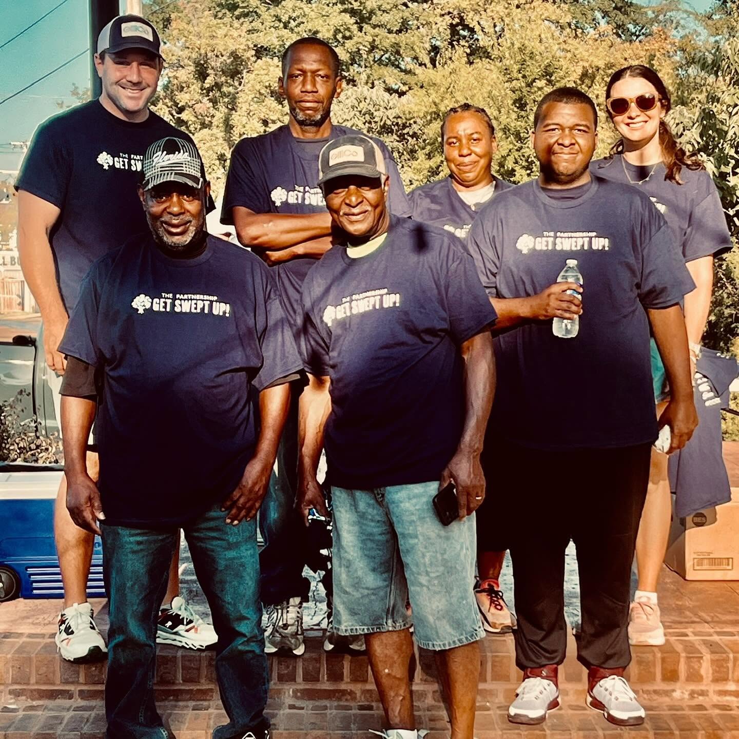 GillCo community cleanup group gathered on brick steps for Get Swept Up